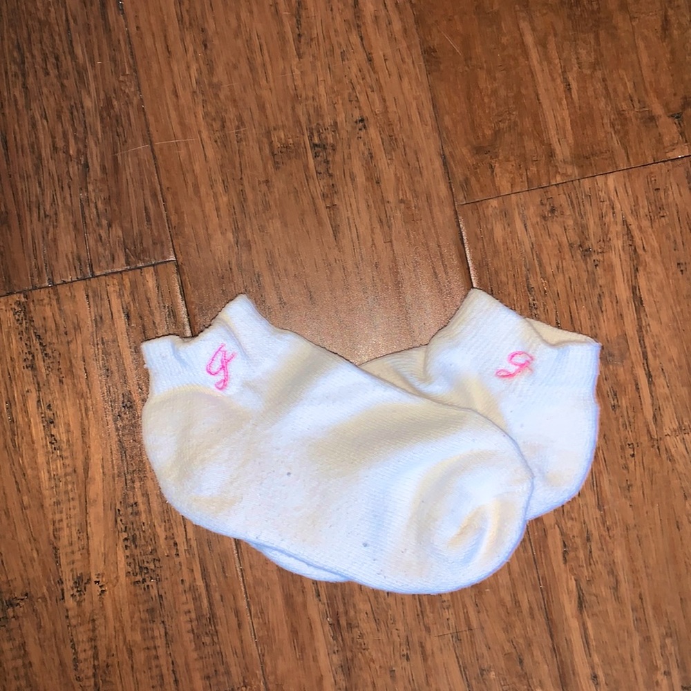 White socks with pink emblem